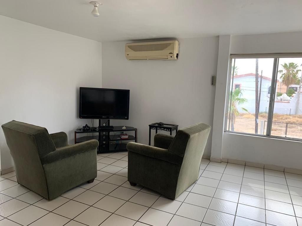 5 de 12: Sala de Departamento en planta.
