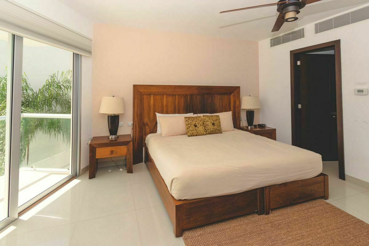 8 of 30: Guest suite 1 with king bed and ensuite bathroom