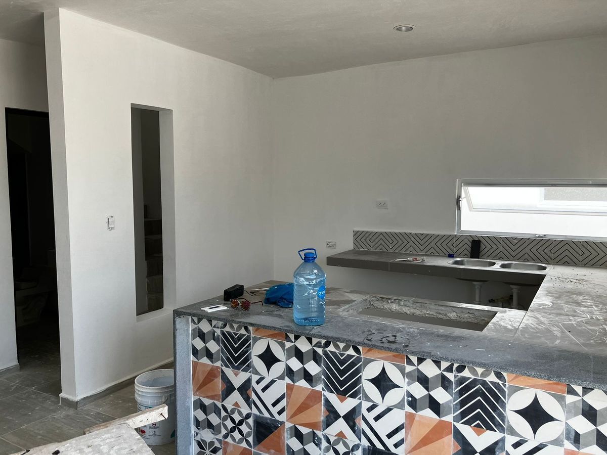 5 of 25: Cocina con barra de cerámica