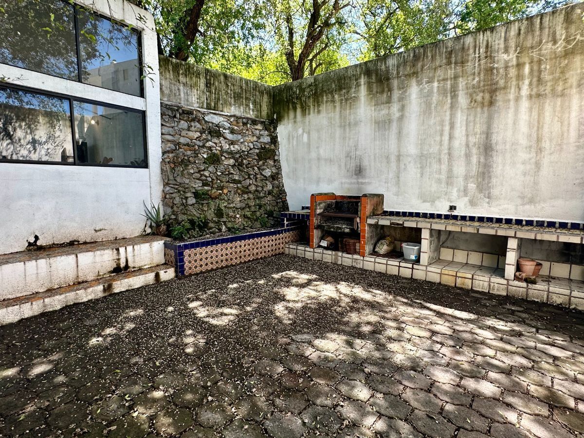 18 de 26: Patio trasero con asador