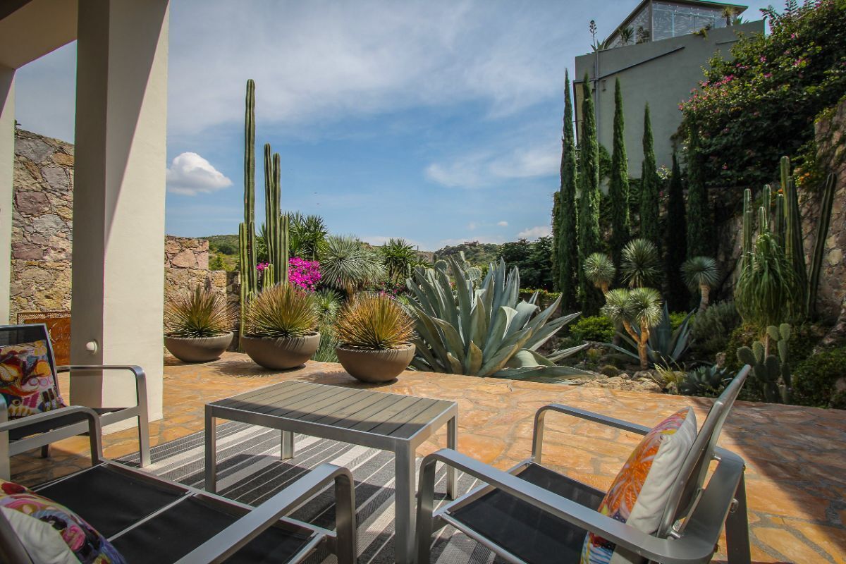1 of 27: Terrace leading to cacti garden with water reservoir views.