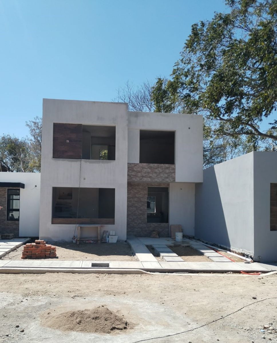 3 de 16: Foto real de avance de casa a punto de terminarse