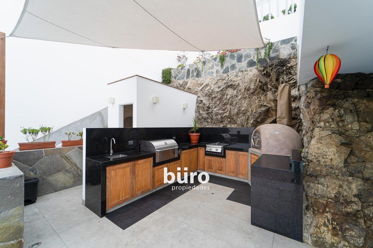 7 de 27: Linda área de BBQ, horno de barro y baño de piscina