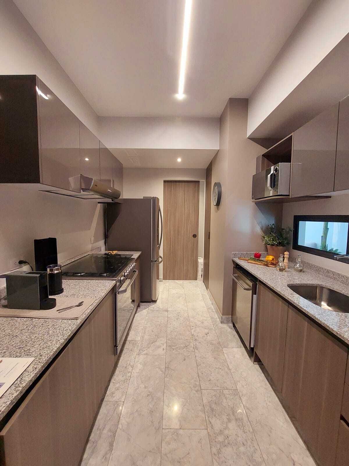 11 de 50: Cocina ya terminada del departamento muestra