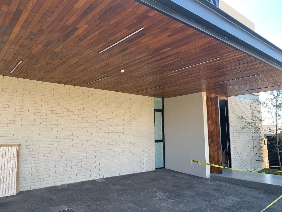 24 de 25: Estacionamiento techado para tres autos