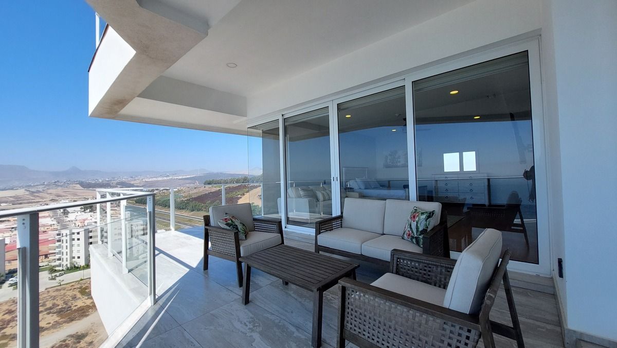 14 de 38: Oceanview terrace from primary bedroom - outdoor lounging
