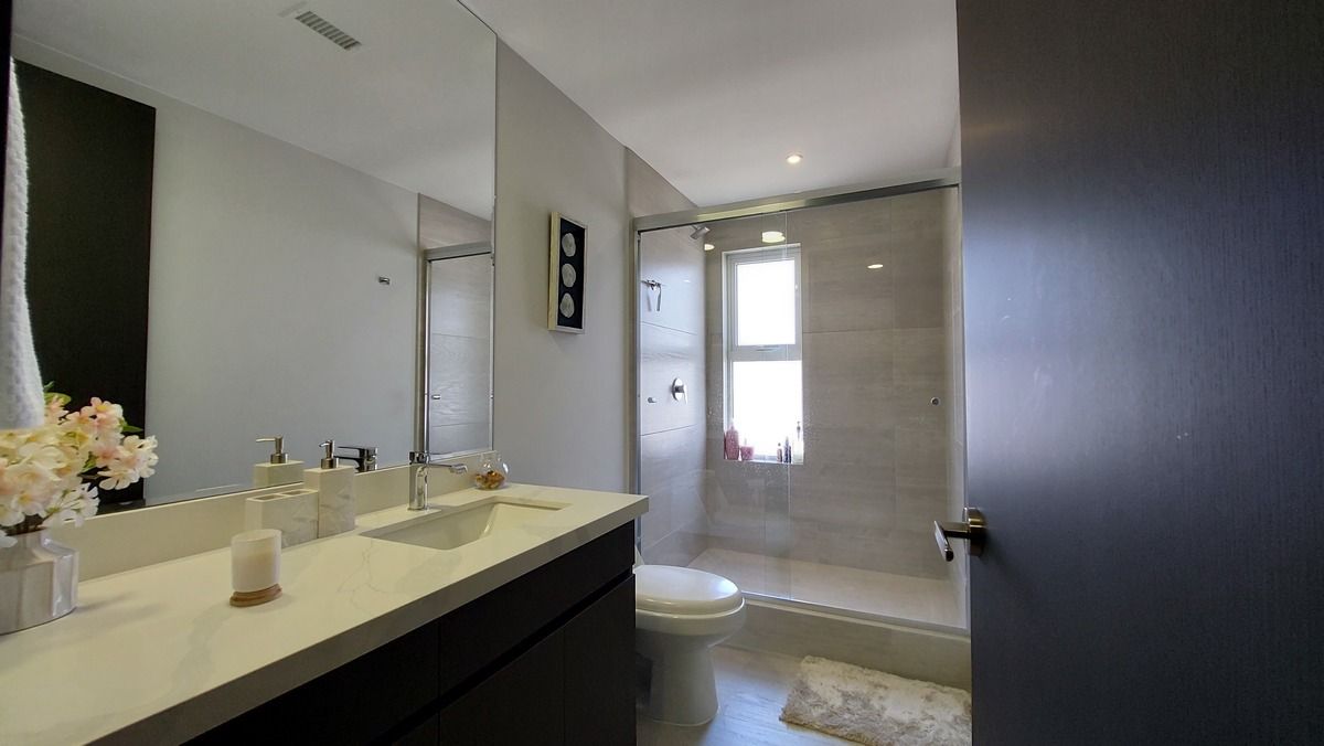 29 de 38: Bathroom with shower, granite countertop, and Vesto vanity