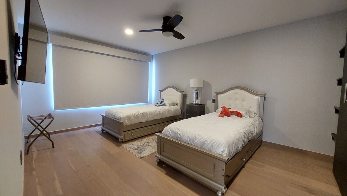 31 de 38: Guest bedroom view from the entrance — warm and  spacious