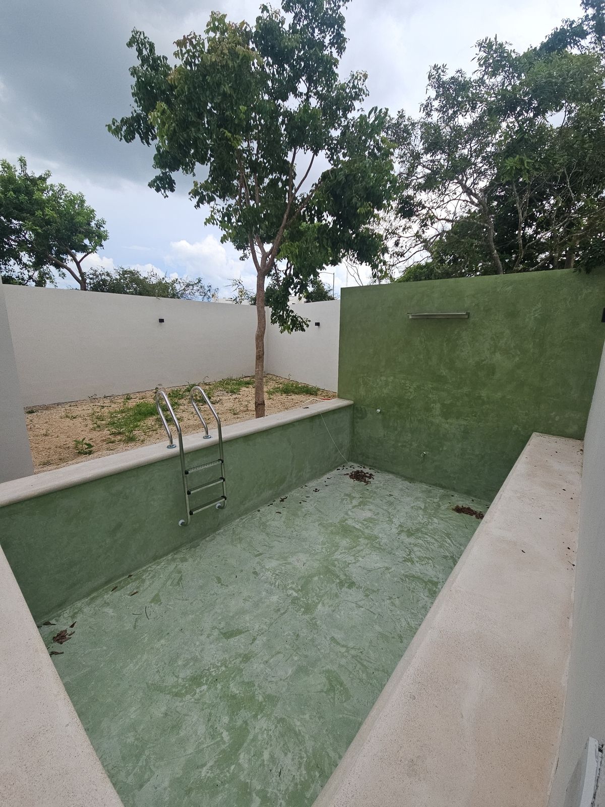13 de 23: Piscina con acabado tipo Chukum Jade