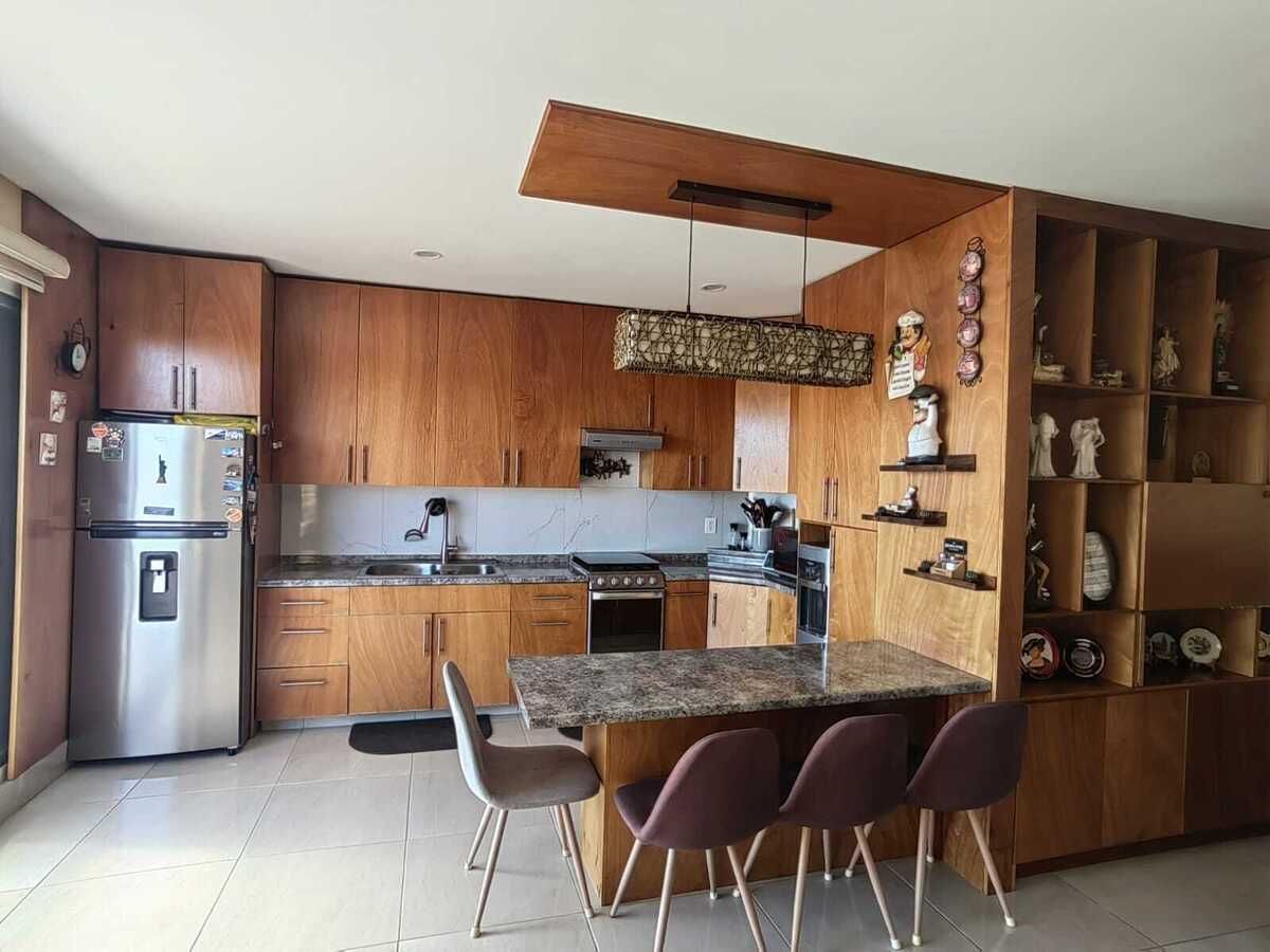 20 de 34: Cocina departamento piso superior