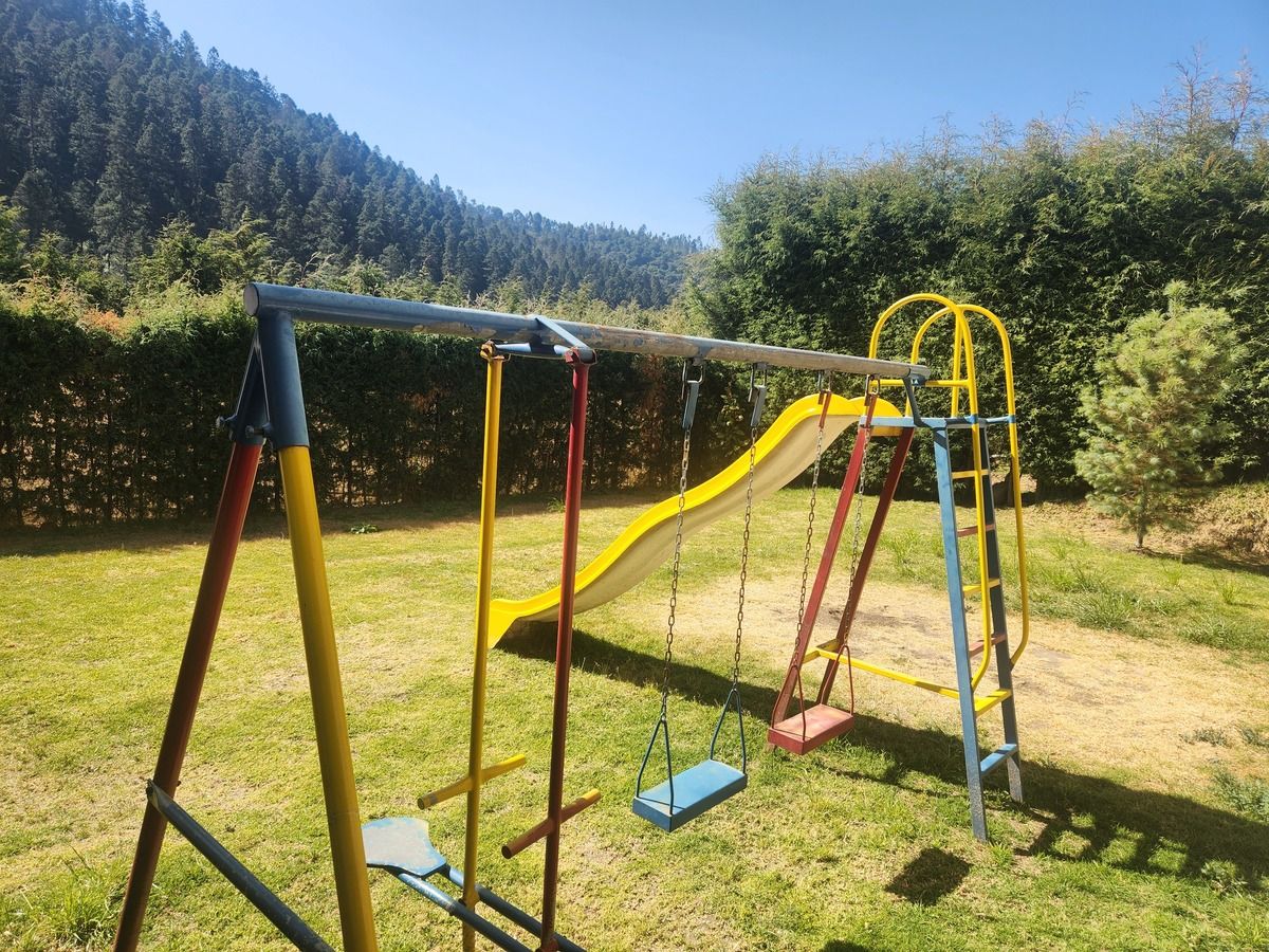 12 de 26: Amplio jardín con juegos