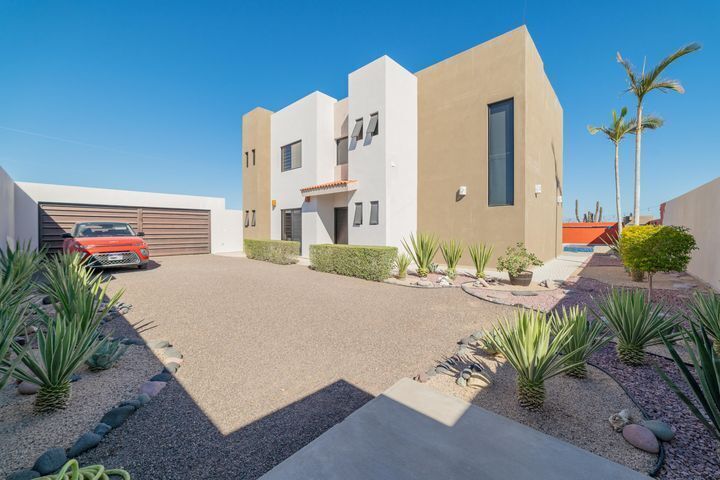 2 of 35: Front of house with gardens and parking