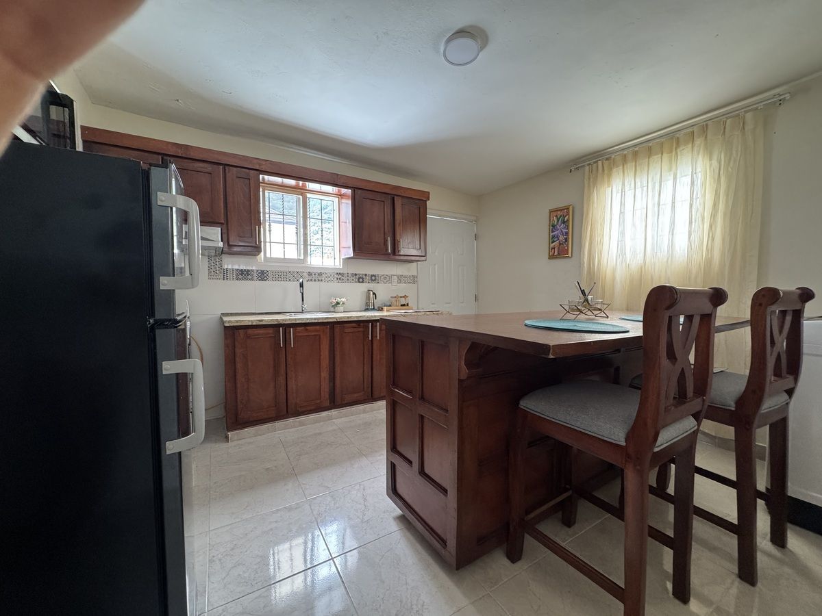 1 of 8: Kitchen and breakfast bar