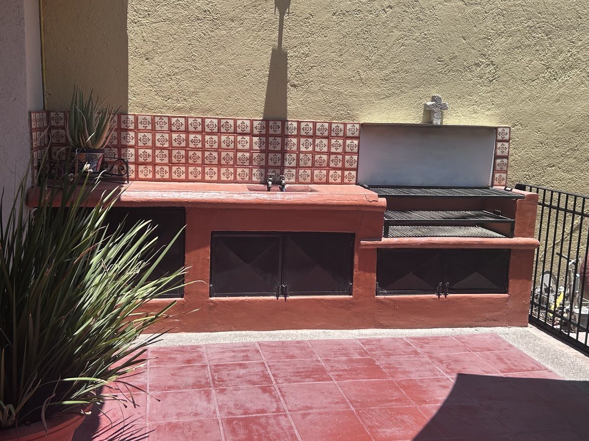 19 de 22: Patio trasero externo con asador