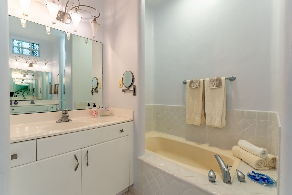 14 of 22: Master bath with tub and shower