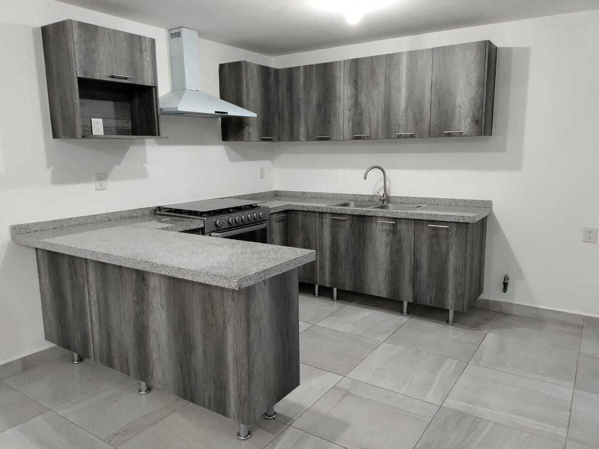 cocina equipada con barra de granito y doble tarja