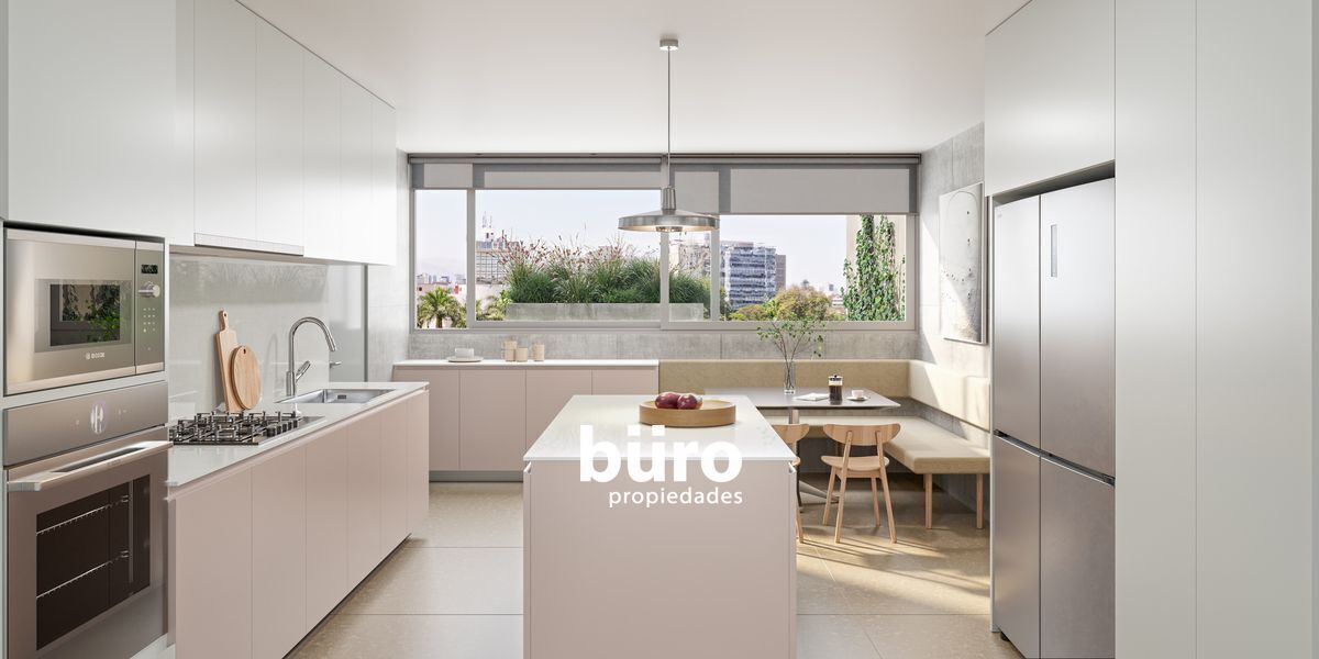 7 de 14: Cocina con isla y comedor diario