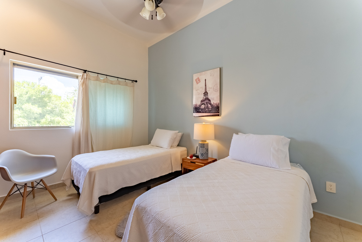 13 of 21: Guest bdrm twin beds