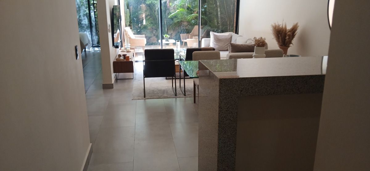 5 de 50: Open-concept Tulum living area with garden views