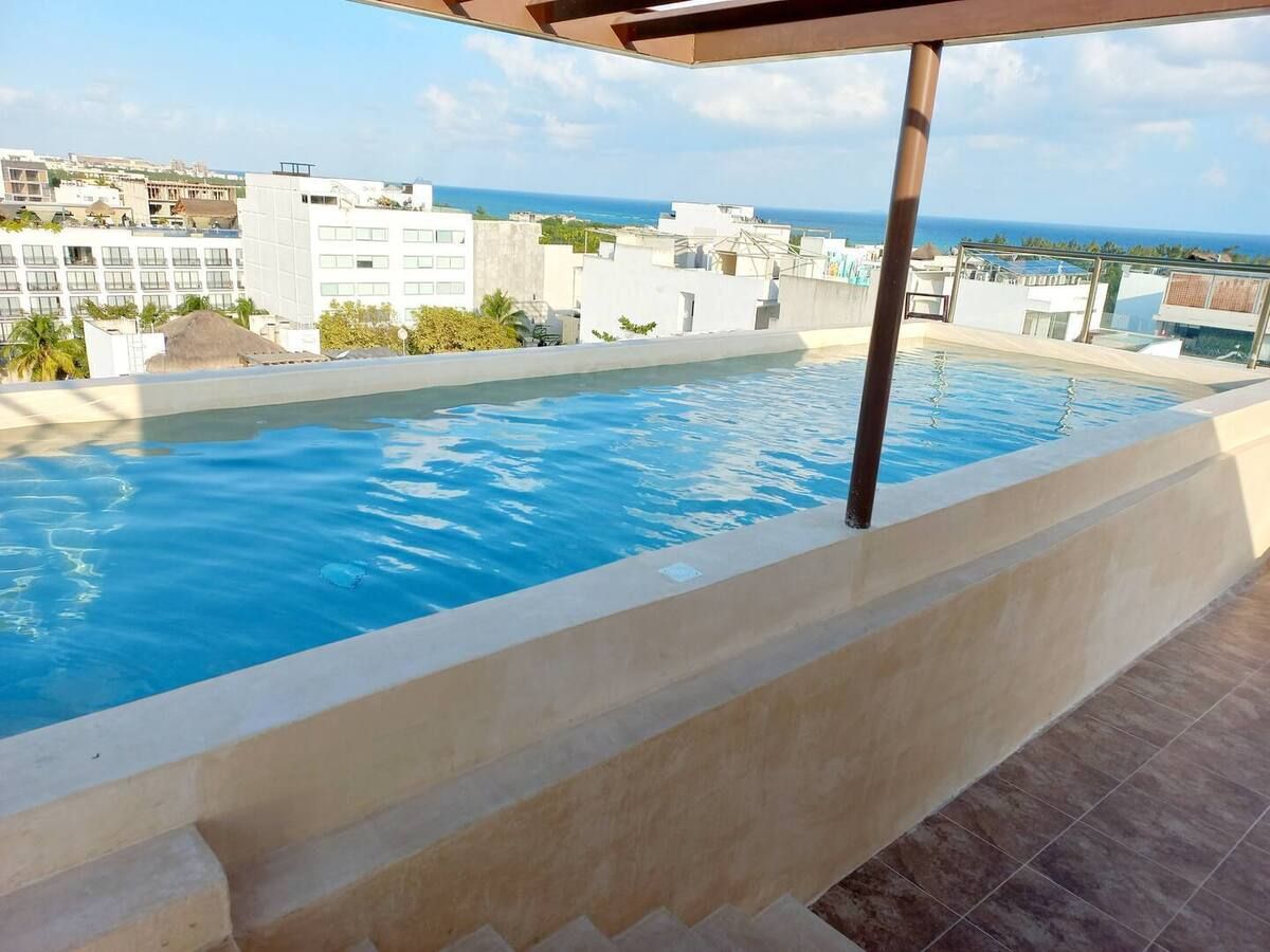 2 of 11: una piscina en 5ta lia playa del carmen