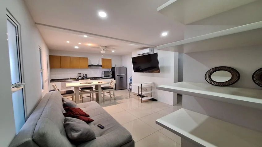 4 of 11: una sala sofa en yaakun condos playa del carmen