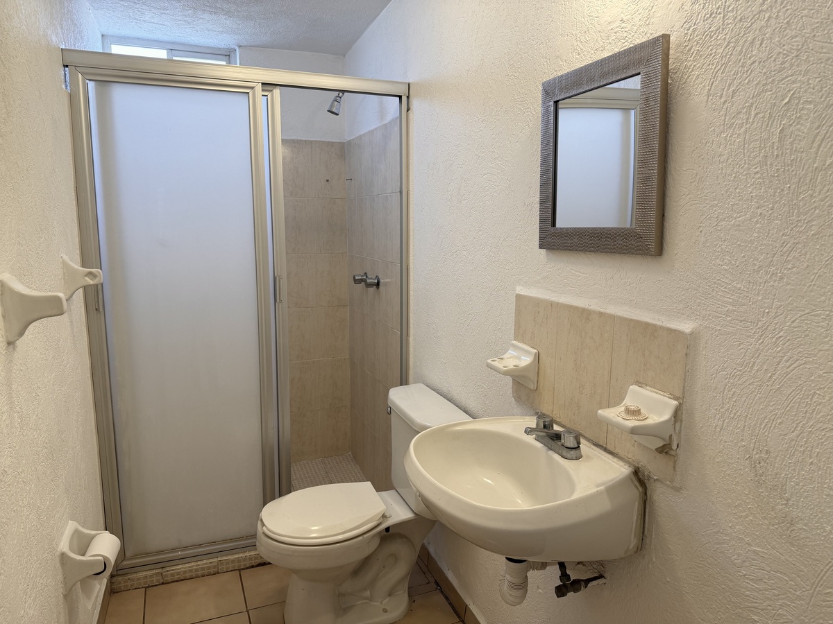 16 de 27: Baño Compartido