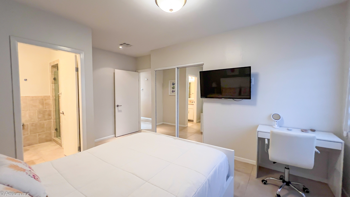 16 of 39: Secondary bedroom with full bathroom