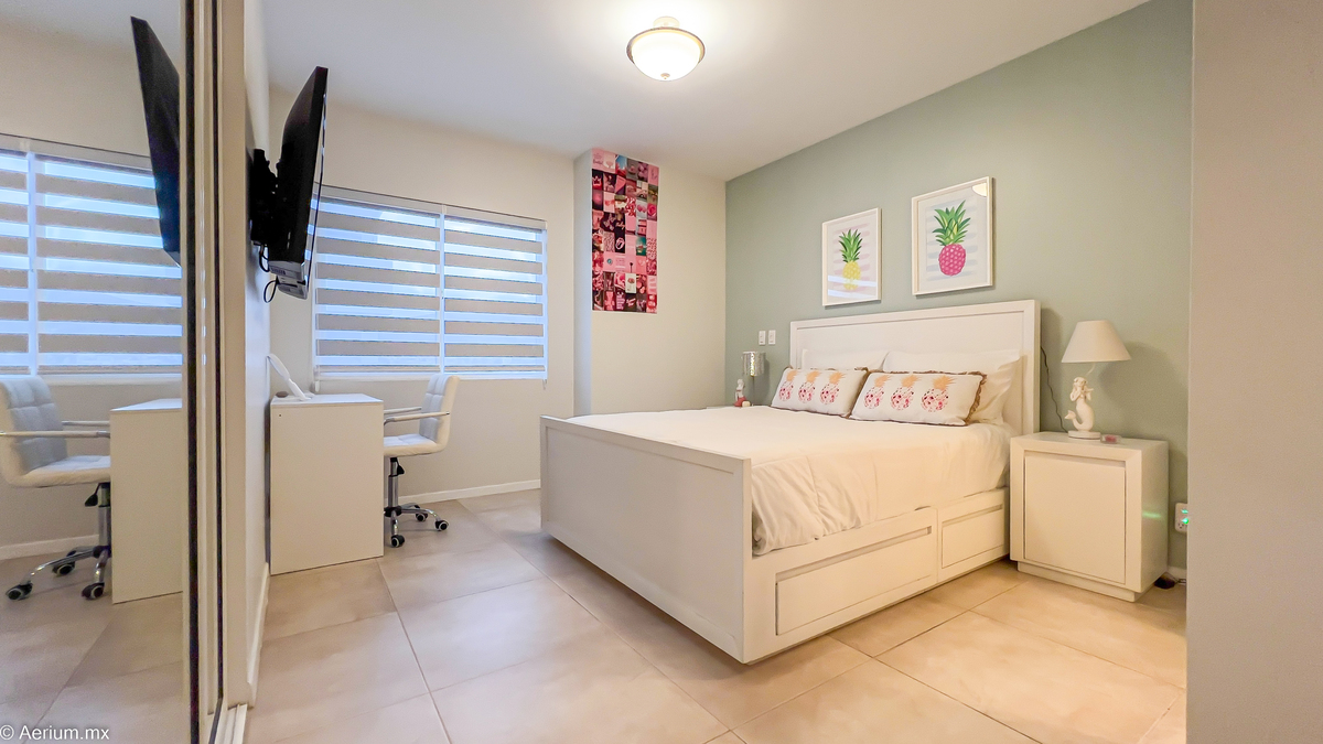 15 of 39: Secondary bedroom with full bathroom