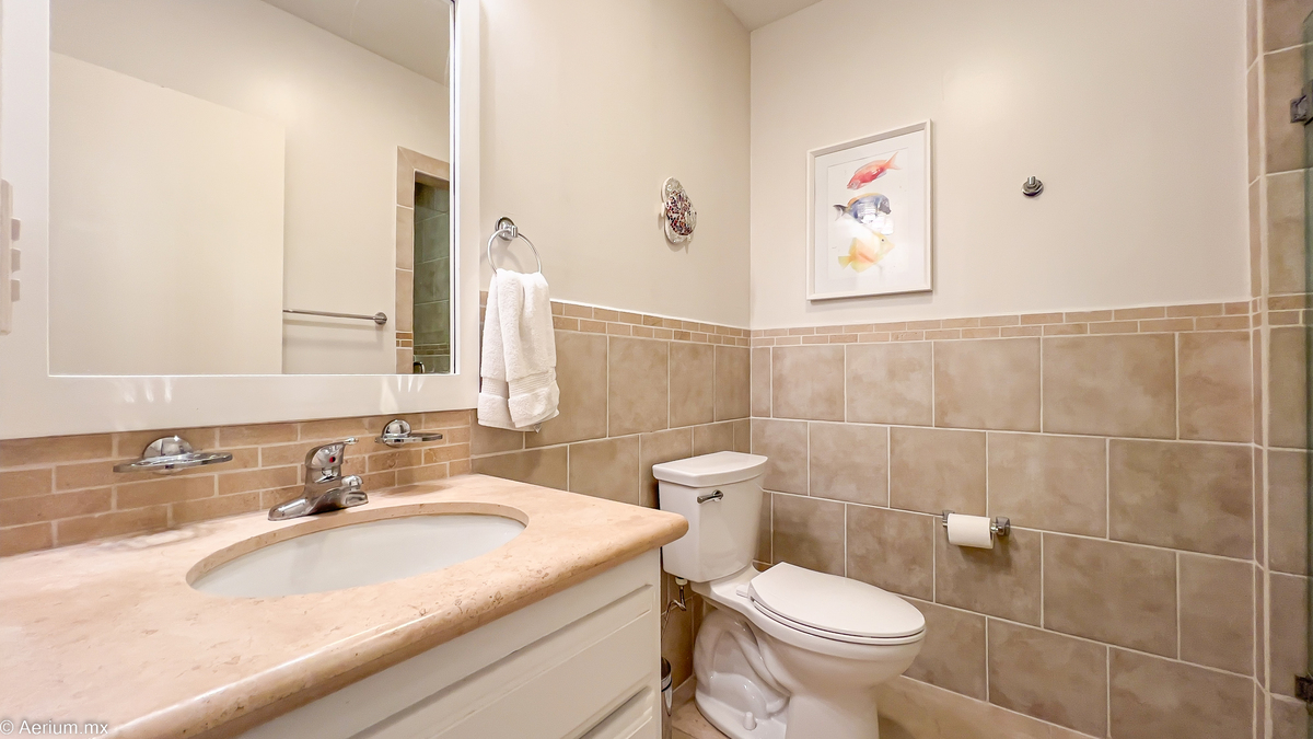17 of 39: Secondary bedroom with full bathroom