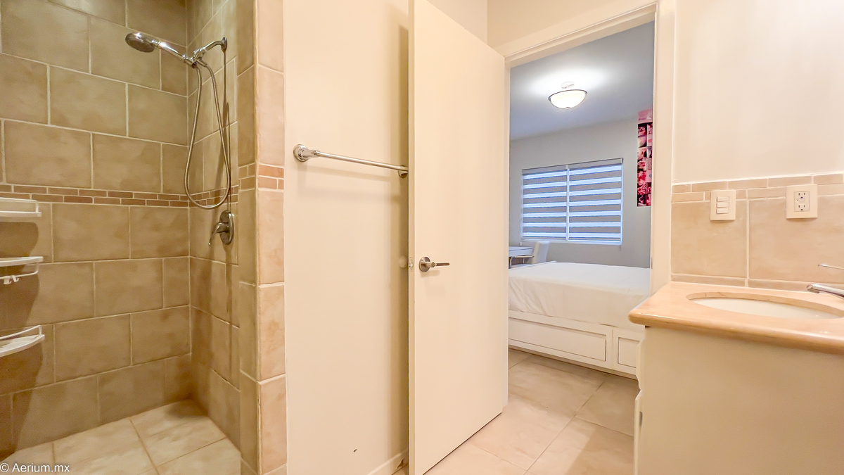 18 of 39: Secondary bedroom with full bathroom