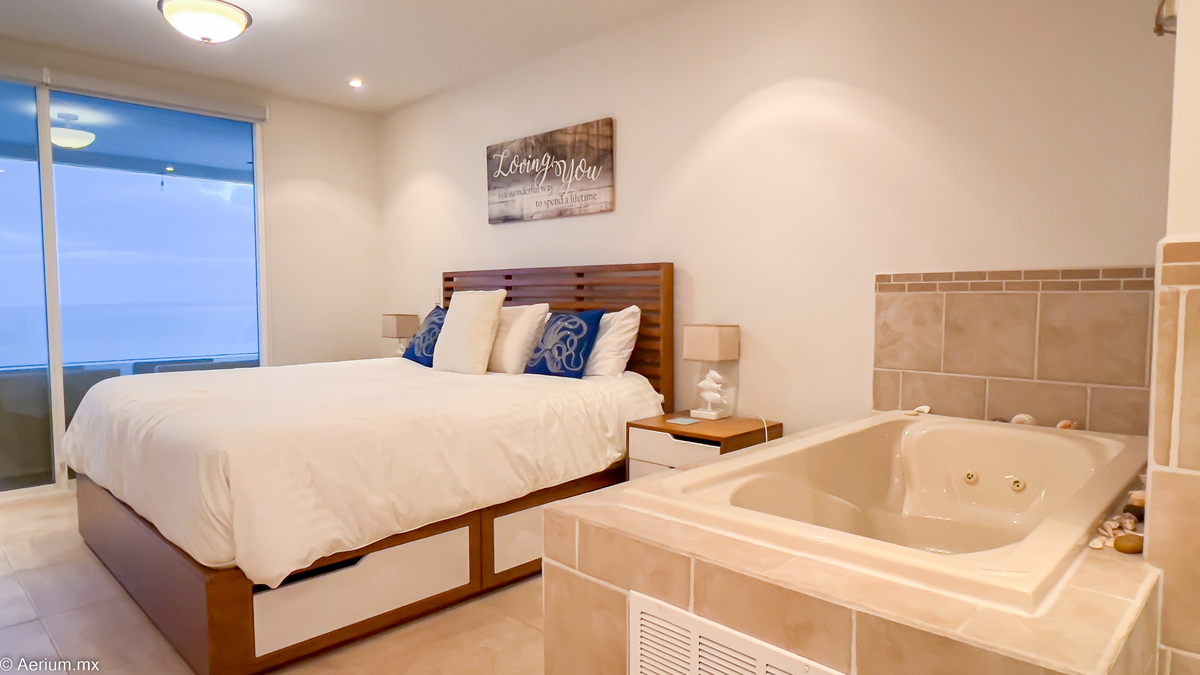 26 of 39: Master bedroom with interior jacuzzi
