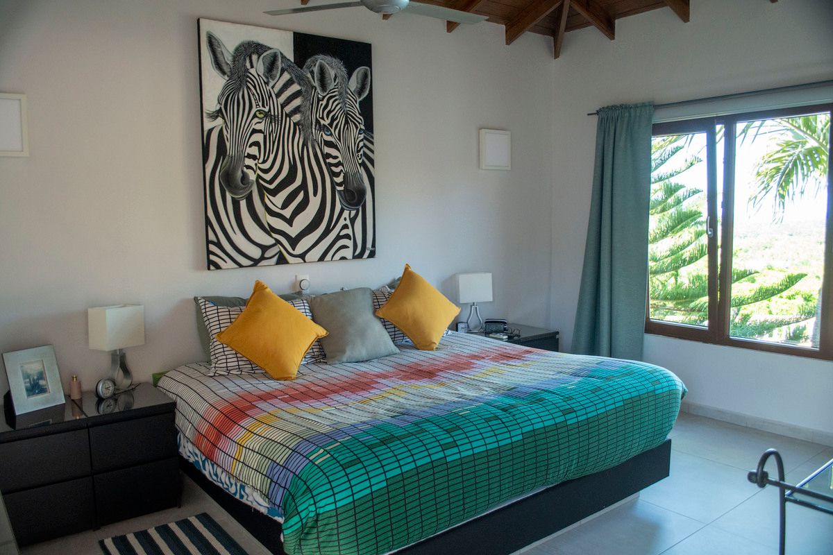 14 of 18: Master Bedroom with View on Pool