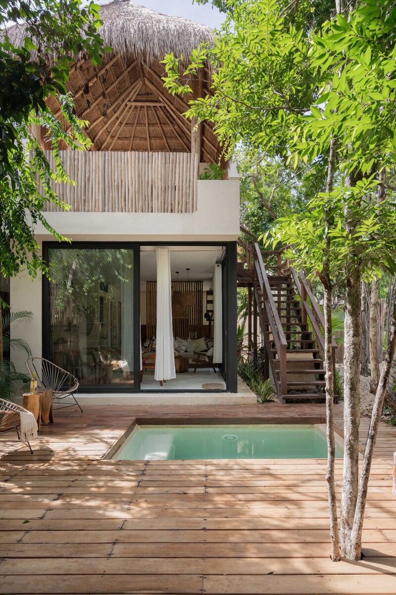 4 of 17: Two-Level Jungle Loft with Full Glass Frontage.
