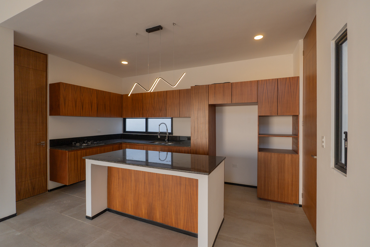 16 of 32: Cocina equipada con carpintería de Parota