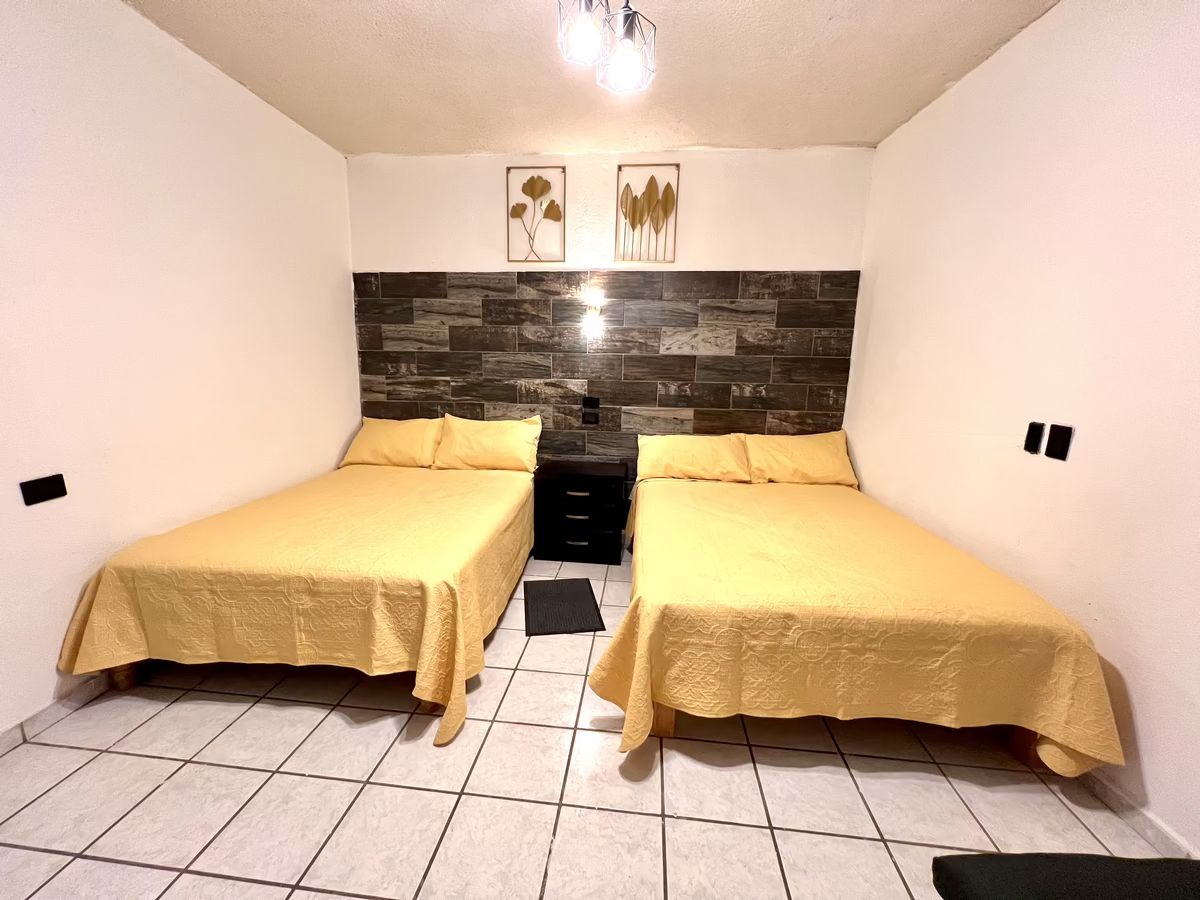2 de 9: Habitación con 2 camas matrimoniales