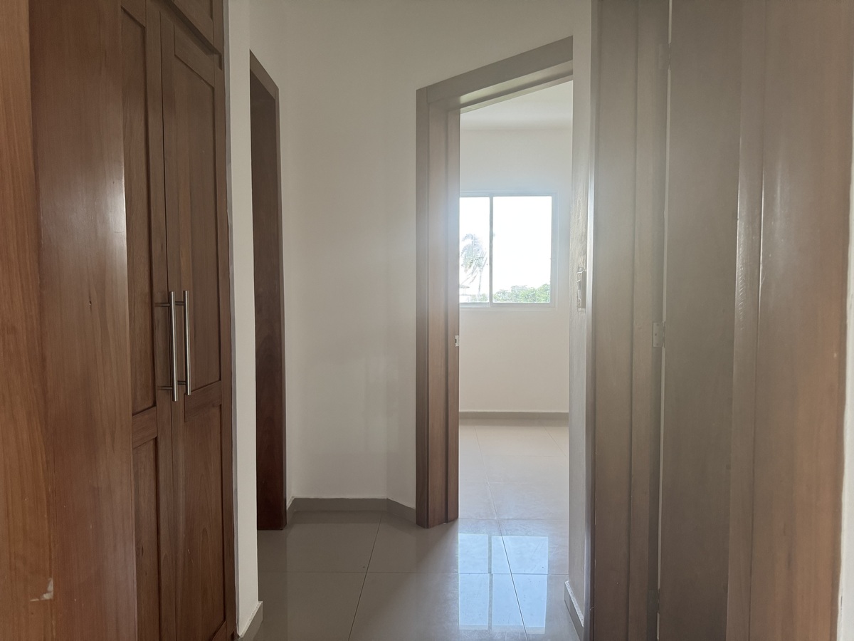 10 of 16: Hallway to bedrooms