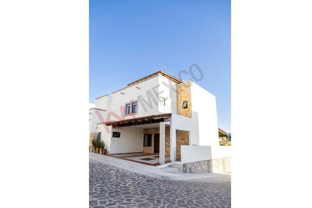 4 of 22: San Miguel Allende modern home covered parking stone accents