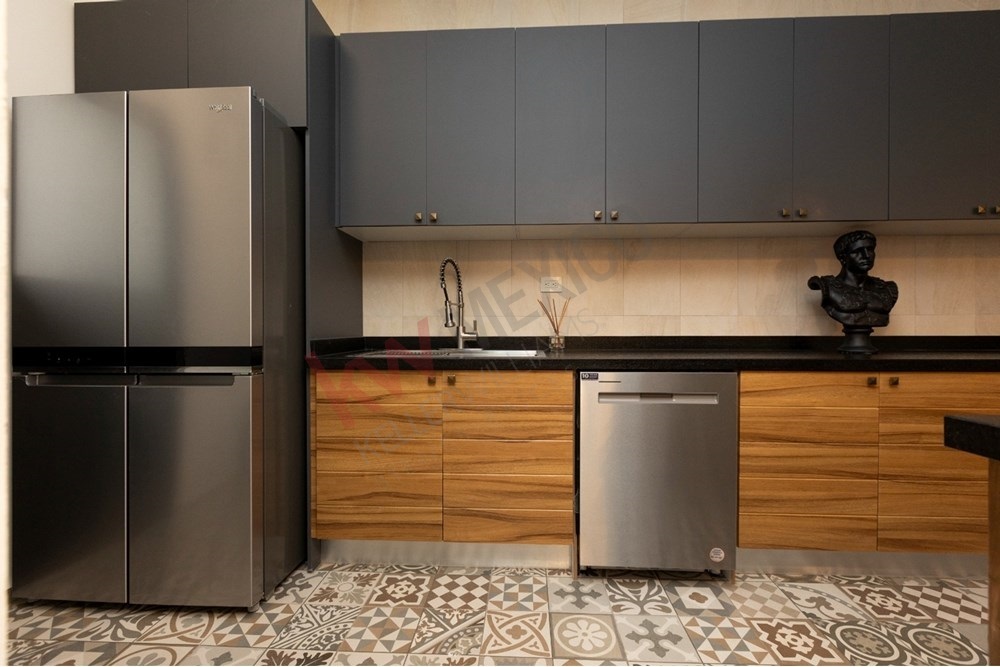 20 of 22: Modern kitchen, island cooktop, and beautiful patterned tile