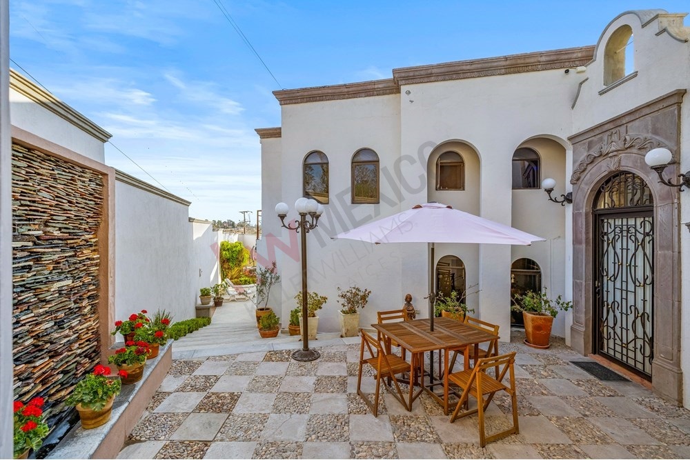 2 of 19: Colonial Courtyard, Stone Wall, Outdoor Dining, Elegant Arch