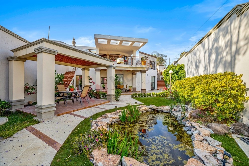 3 of 19: Colonial Garden, Covered Patio, Water Feature