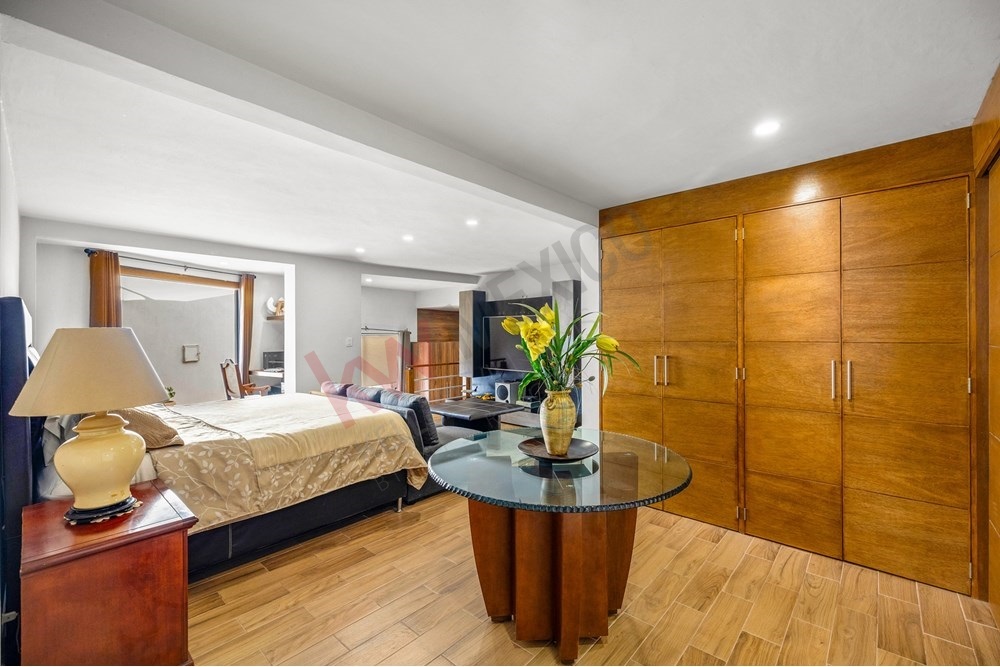 6 of 19: Primary Suite, Wood Closets, Glass Table, Open ConceptLayout