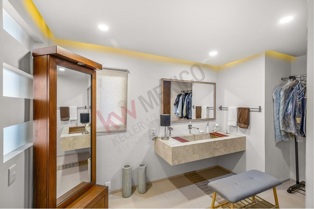 7 of 19: Modern Powder Room, Decorative Mirrors, Granite Vanity Top.