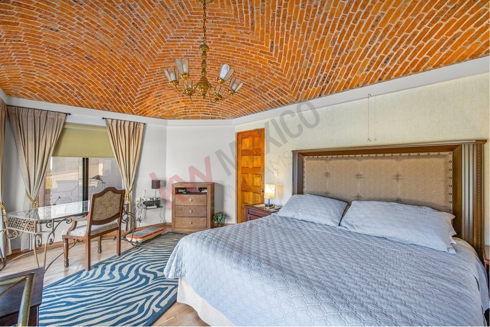 11 of 19: Master Bedroom, Catalan Vault Ceiling, Panoramic Views,