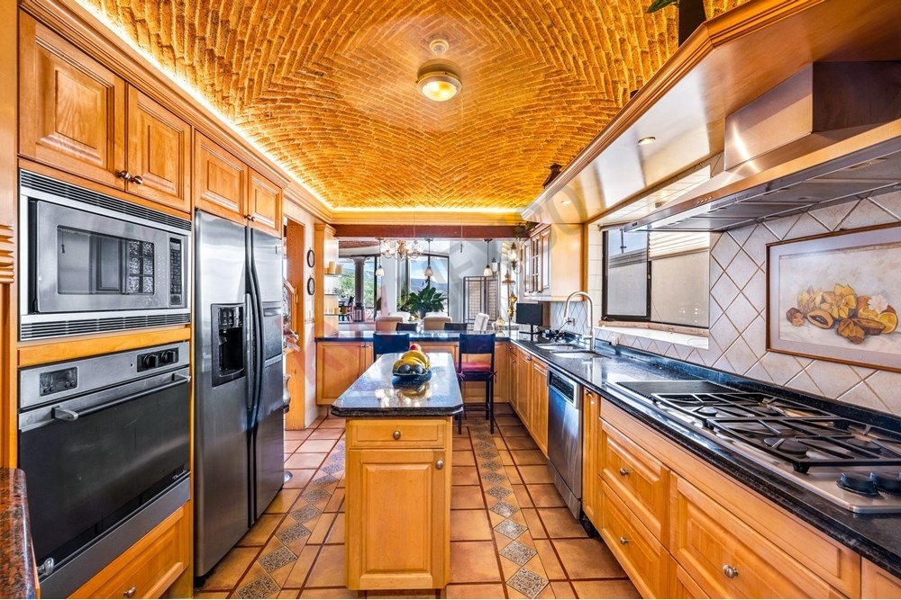 13 of 19: Gourmet Kitchen, Catalan Vault, Center Island