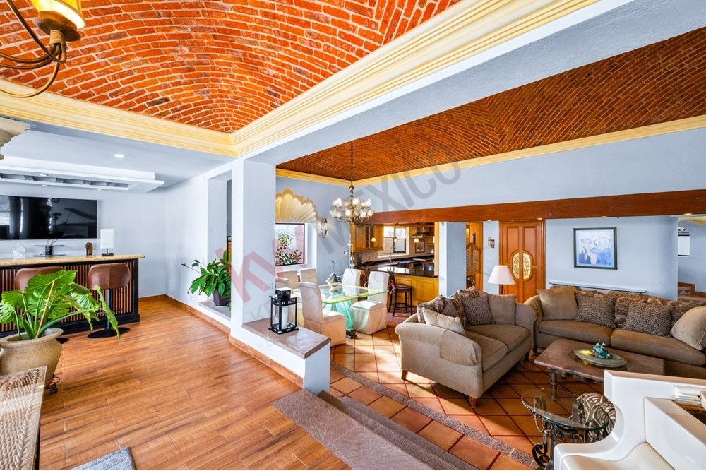 15 of 19: Mexican Colonial living bar area Catalan brick ceiling.