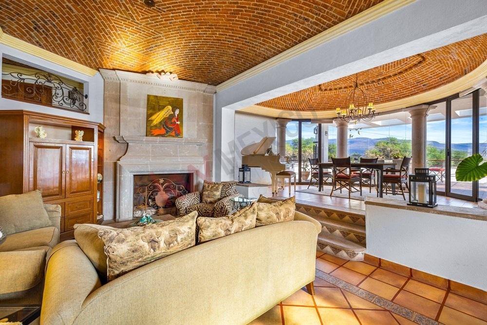 16 of 19: "Colonial living room with brick Catalan vault and fireplace