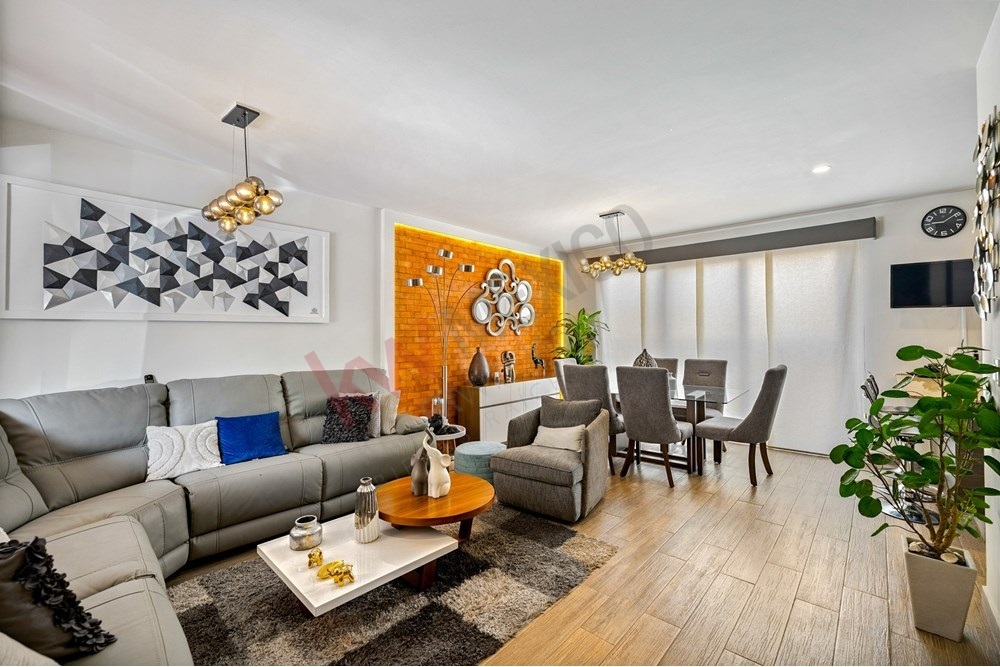 2 of 27: Open Concept Living/Dining Room with Contemporary Furnishing