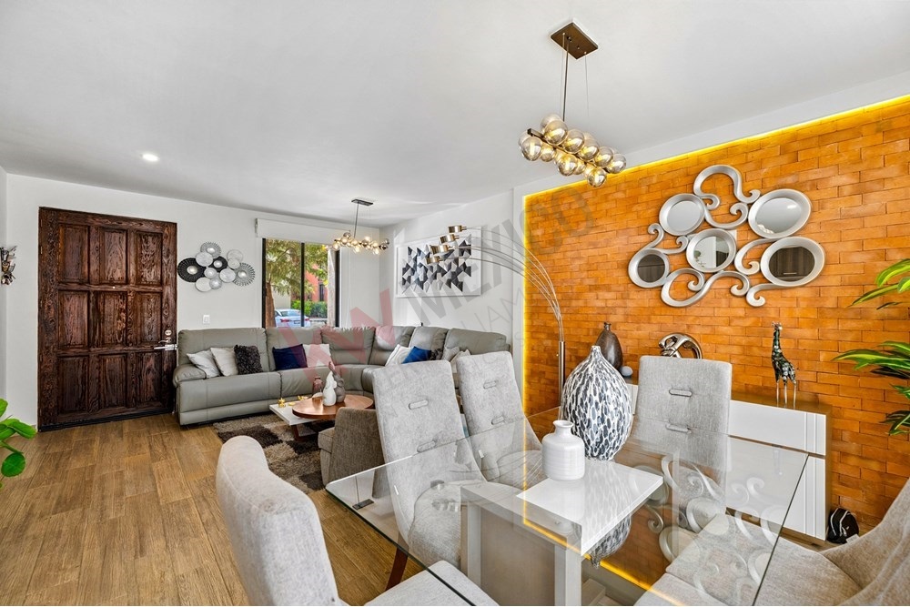 3 of 27: Glass Dining Table and Brick Accent Wall Interior