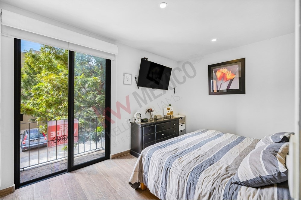 9 of 27: Bright Bedroom, Sliding Glass Door, Private Balcony View.