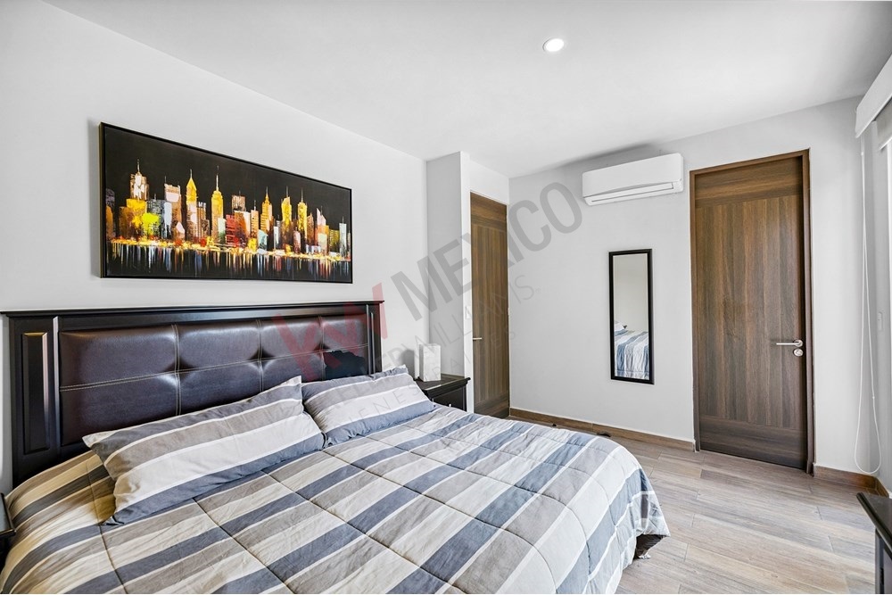 10 of 27: Spacious Primary Bedroom, Air Conditioning, Wood Grain Doors